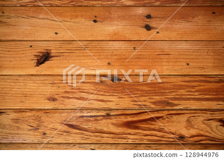 Golden orange wooden texture background 128944976