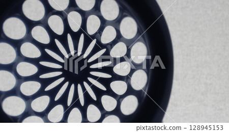 Round perforated pattern similar to the design of an aircraft turbine Round perforated pattern similar to the design of an aircraft turbine 128945153