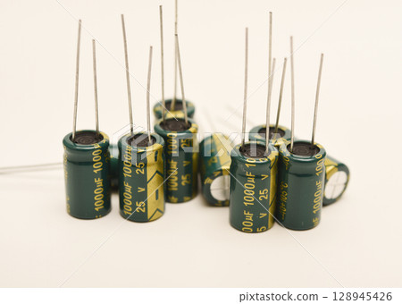 Electrolytic capacitors of different nominal values. Energy storage devices. Electronic radio elements. 128945426