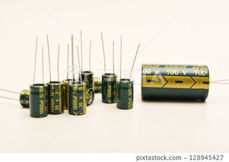 Electrolytic capacitors of different nominal values. Energy storage devices. Electronic radio elements. 128945427