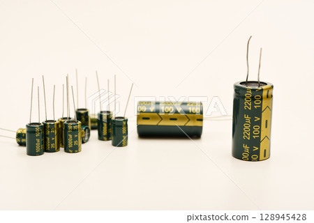 Electrolytic capacitors of different nominal values. Energy storage devices. Electronic radio elements. 128945428