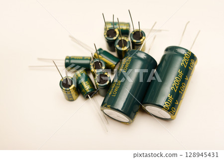 Electrolytic capacitors of different nominal values. Energy storage devices. Electronic radio elements. 128945431