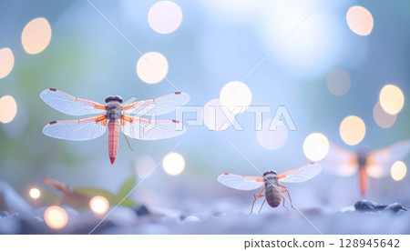 A dragonfly flapping its wings in the fantastic light and a ball of gently sparkling light. A fantastical scene that makes you feel the mystery of life. Beautiful. 128945642