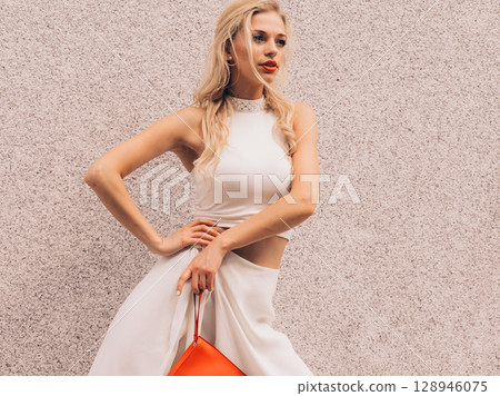 Woman wearing crop top and culottes Woman wearing crop top and culottes 128946075