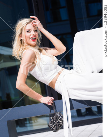 Woman wearing crop top and culottes Woman wearing crop top and culottes 128946082