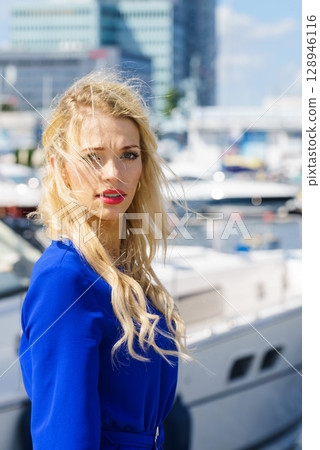 Fashion model wearing blue jumpsuit Fashion model wearing blue jumpsuit 128946116