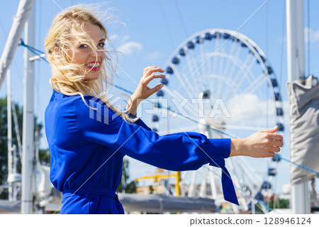 Fashion model and ferris wheel Fashion model and ferris wheel 128946124