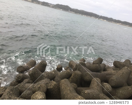 Kamakura & Enoshima Walking Tour 2023 Edition Waves crashing on wave-breaking blocks 128946573