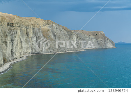Stunning Coastal Cliffs Along the Serene Blue Waters of a Cape Bugaz 128946754