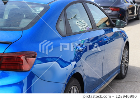 A display scene at an American car dealership with a wide selection of popular models: Ford, Chevrolet, Dutch, pickup trucks, A display scene at an American car dealership with a wide selection of popular models: Ford, Chevrolet, Dutch, pickup trucks, 128946990
