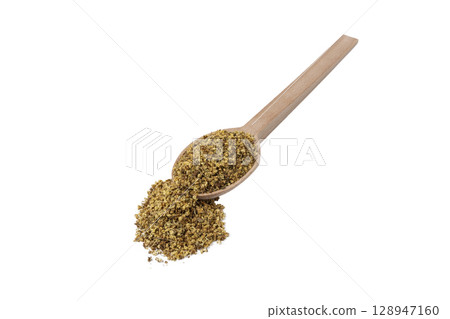 dried flowers of black lilac or black elder in latin sambuci flos on wooden spoon isolated on white background.  Herbs. Alternative medicine. 128947160