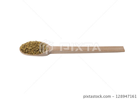 dried flowers of black lilac or black elder in latin sambuci flos on wooden spoon isolated on white background.  Herbs. Alternative medicine. 128947161