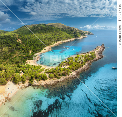 Aerial view of Cala Agulla beach, turquoise water, white sand 128947340