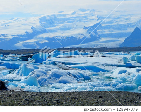 Iceland diamond beach glacial lake Jokulsarlon lagoon with icebergs, ice floes.  128947379