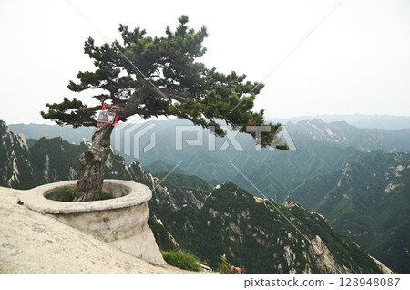 Mount Huashan is one of the most famous tourist attractions in China and one of the must-do activities is rock climbing and hiking. It is a sacred mountain, home to many deities. 128948087