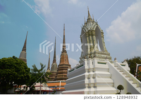 Classic Thai architecture with pagoda in Wat Phra Chetuphon or Wat Pho. Which is one of the largest and oldest temples and is popular with both Thai and foreign tourists. Located at Bangkok city. Classic Thai architecture with pagoda in Wat Phra Chetuphon or Wat Pho. Which is one of the largest and oldest temples and is popular with both Thai and foreign tourists. Located at Bangkok city. 128948932
