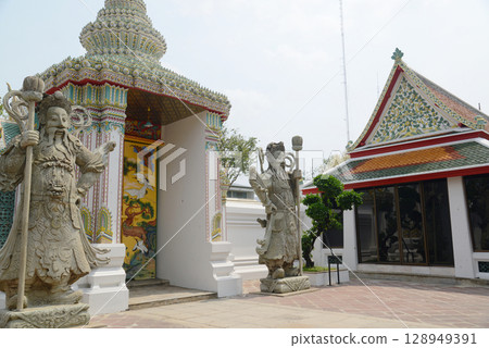 Chinese guardian statue at the gate of Wat Pho Which is one of the largest and oldest temples in Bangkok and is popular with both Thai and foreign tourists. Chinese guardian statue at the gate of Wat Pho Which is one of the largest and oldest temples in Bangkok and is popular with both Thai and foreign tourists. 128949391