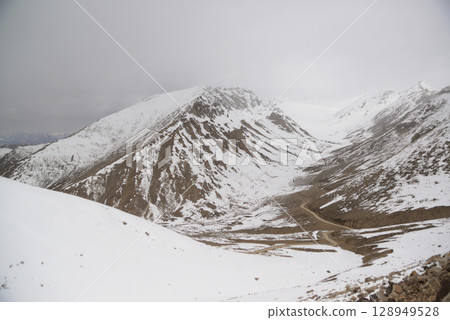 The view from Khardung La pass. This pass is located in the Ladakh mountains north of Leh and connects the Indus and Shyok river valleys and is the highest motorable road in the world. The view from Khardung La pass. This pass is located in the Ladakh mountains north of Leh and connects the Indus and Shyok river valleys and is the highest motorable road in the world. 128949528
