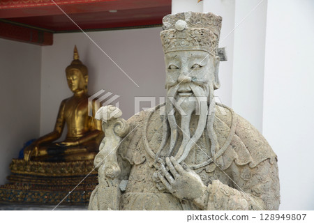 Chinese warrior statues decorate the covered chapel with Buddha statues at the back of Wat Pho, a popular place for both Thai and international tourists. Chinese warrior statues decorate the covered chapel with Buddha statues at the back of Wat Pho, a popular place for both Thai and international tourists. 128949807