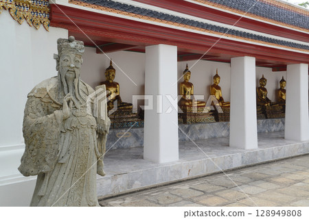 Chinese warrior statues decorate the covered chapel with Buddha statues at the back of Wat Pho, a popular place for both Thai and international tourists. Chinese warrior statues decorate the covered chapel with Buddha statues at the back of Wat Pho, a popular place for both Thai and international tourists. 128949808