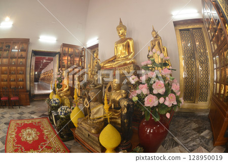 The golden sitting Buddha statue is made of bronze and is enshrined in Wat Phra Chetuphon Wimonmangklaram or Wat Pho is popular with both Thai and foreign tourists. The golden sitting Buddha statue is made of bronze and is enshrined in Wat Phra Chetuphon Wimonmangklaram or Wat Pho is popular with both Thai and foreign tourists. 128950019