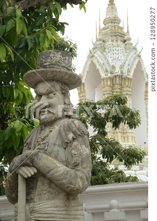 Chinese guardian statue at the gate of Wat Pho Which is one of the largest and oldest temples in Bangkok and is popular with both Thai and foreign tourists. Chinese guardian statue at the gate of Wat Pho Which is one of the largest and oldest temples in Bangkok and is popular with both Thai and foreign tourists. 128950277