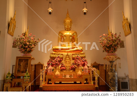 The golden sitting Buddha statue is made of bronze and is enshrined in Wat Phra Chetuphon Wimonmangklaram or Wat Pho is popular with both Thai and foreign tourists. At Bangkok capital city in Thailand The golden sitting Buddha statue is made of bronze and is enshrined in Wat Phra Chetuphon Wimonmangklaram or Wat Pho is popular with both Thai and foreign tourists. At Bangkok capital city in Thailand 128950283