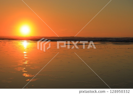 The sea stained in the morning sun 128950332