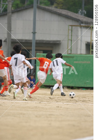 Soccer game, boy, back view 128950356