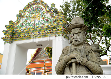 Chinese guardian statue at the gate of Wat Pho Which is one of the largest and oldest temples in Bangkok and is popular with both Thai and foreign tourists. Chinese guardian statue at the gate of Wat Pho Which is one of the largest and oldest temples in Bangkok and is popular with both Thai and foreign tourists. 128951022