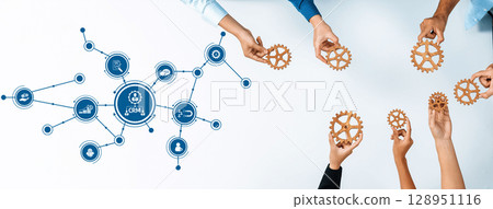 Collaborative Business Strategy Concept with Gears and CRM Connections Showcased on a Table Surrounded by Diverse Hands. Amity 128951116