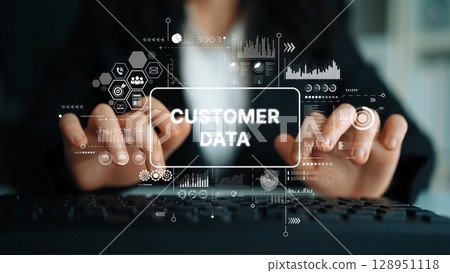 Business Professional Analyzing Customer Data with Digital Graphics and Charts in Modern Office Environment. Asymptotic smart data analytic Business Professional Analyzing Customer Data with Digital Graphics and Charts in Modern Office Environment. Asymptotic smart data analytic 128951118