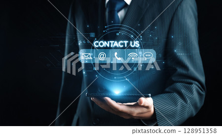 Businessman holding smartphone with digital contact icons and symbols in a professional setting, representing communication and customer interaction. Qubit Businessman holding smartphone with digital contact icons and symbols in a professional setting, representing communication and customer interaction. Qubit 128951358