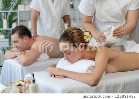 Hot herbal ball spa massage body treatment at day spa . Quiescent Hot herbal ball spa massage body treatment at day spa . Quiescent 128951452