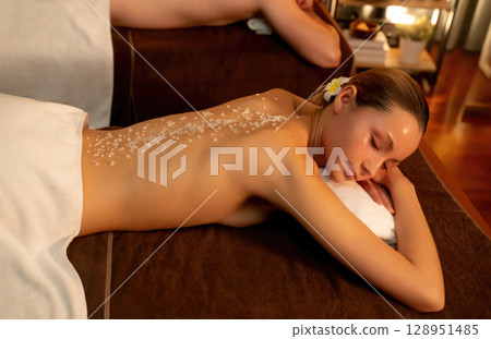 Couple customer having exfoliation treatment in luxury spa. Quiescent 128951485