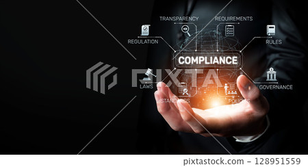 Businessman Hand Holding Holographic Compliance Icons for Regulation, Governance, and Transparency in the Digital Age XDMCP 128951559