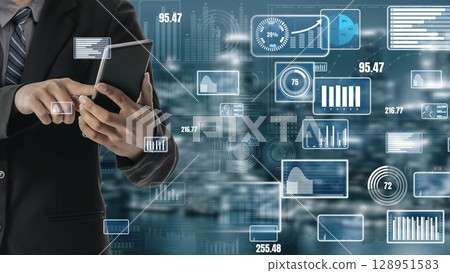 Business Professional Using Tablet with Digital Data Visualization in Background, Analyzing Market Insights and Financial Reports for Strategic Decision Making xenic 128951583