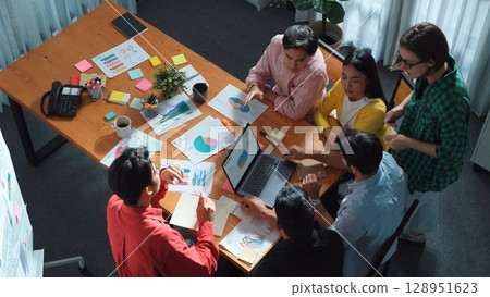 Group of smart business people working together to analyze graph. Convocation. Group of smart business people working together to analyze graph. Convocation. 128951623