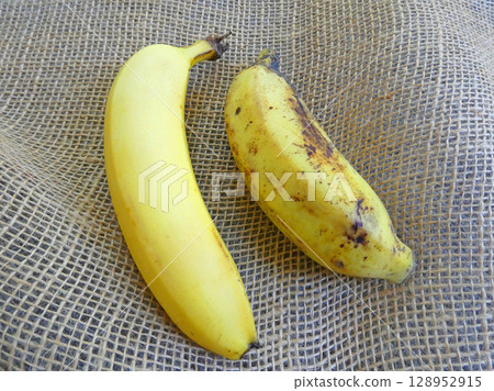 A thick, short, chunky apple banana. A photo of a ripe apple banana and a regular banana. A thick, short, chunky apple banana. A photo of a ripe apple banana and a regular banana. 128952915