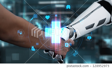 Close up of robot and human shake hand with medical cross hologram. Salubrious. 128952973
