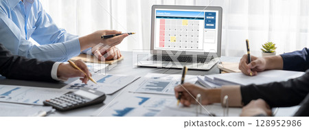Analyst team working on data analysis dashboard on laptop screen. Insight Analyst team working on data analysis dashboard on laptop screen. Insight 128952986