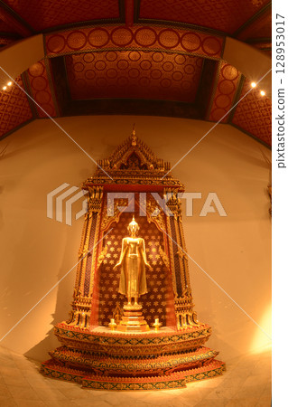 The standing Buddha statue is made of bronze and is enshrined in Wat Phra Chetuphon Wimonmangklaram or Wat Pho is popular with both Thai and foreign tourists. Located at Bangkok city in Thailand. The standing Buddha statue is made of bronze and is enshrined in Wat Phra Chetuphon Wimonmangklaram or Wat Pho is popular with both Thai and foreign tourists. Located at Bangkok city in Thailand. 128953017