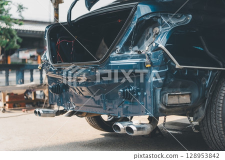 Checking car body work fiber bumper at car garage Checking car body work fiber bumper at car garage 128953842