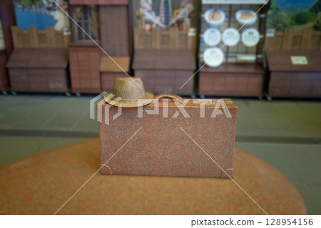 Tora-san's stone bag and hat at the Tora-san Memorial Museum 128954156