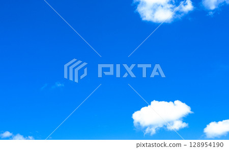A simple landscape of a refreshing blue sky and white clouds A simple landscape of a refreshing blue sky and white clouds 128954190