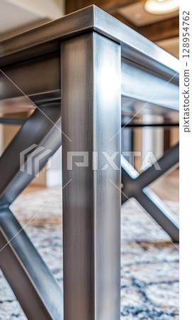 A silver table with a wood grain finish and a black border 128954762