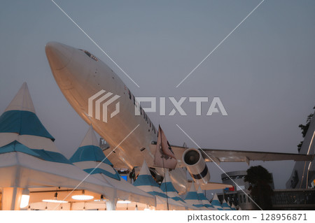 A Dramatic Aerial View of an Airplane Demonstrating Exceptional Artistry in the World of Aviation A Dramatic Aerial View of an Airplane Demonstrating Exceptional Artistry in the World of Aviation 128956871