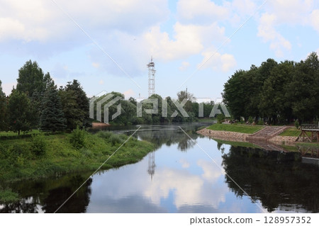 A Serene River Landscape Capturing the Beautiful Tower Reflections in Natures Calm 128957352