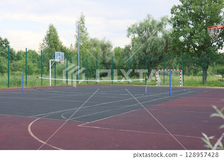 A Welcoming Outdoor Basketball and Handball Court Nestled in Beautiful, Natural Surroundings 128957428