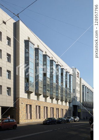 Modern architectural design of urban buildings reflects contemporary aesthetics and functionality 128957766